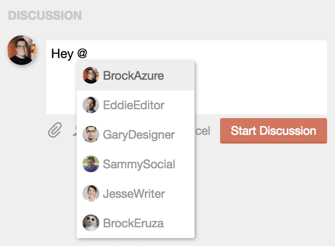 Discussion comment with @ typed and a list of team members to mention.