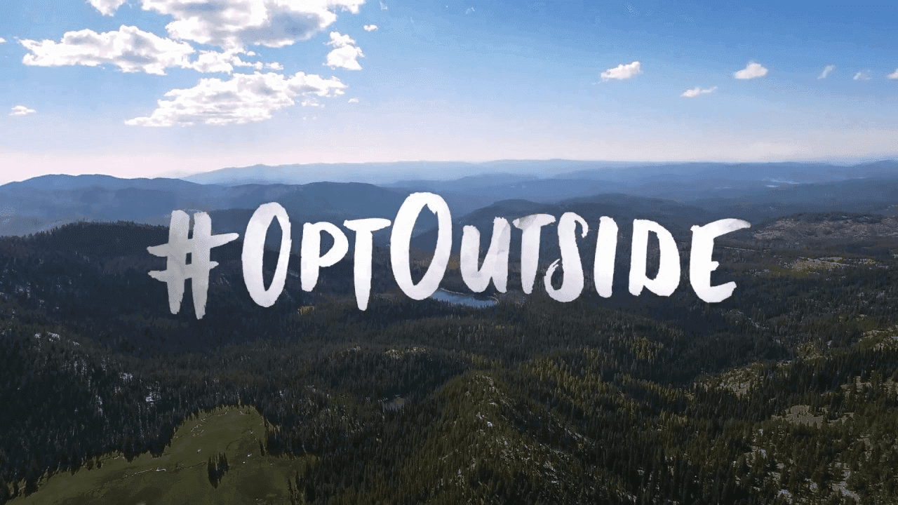 Beautiful landscape and bright blue sky with the text #OptOutside