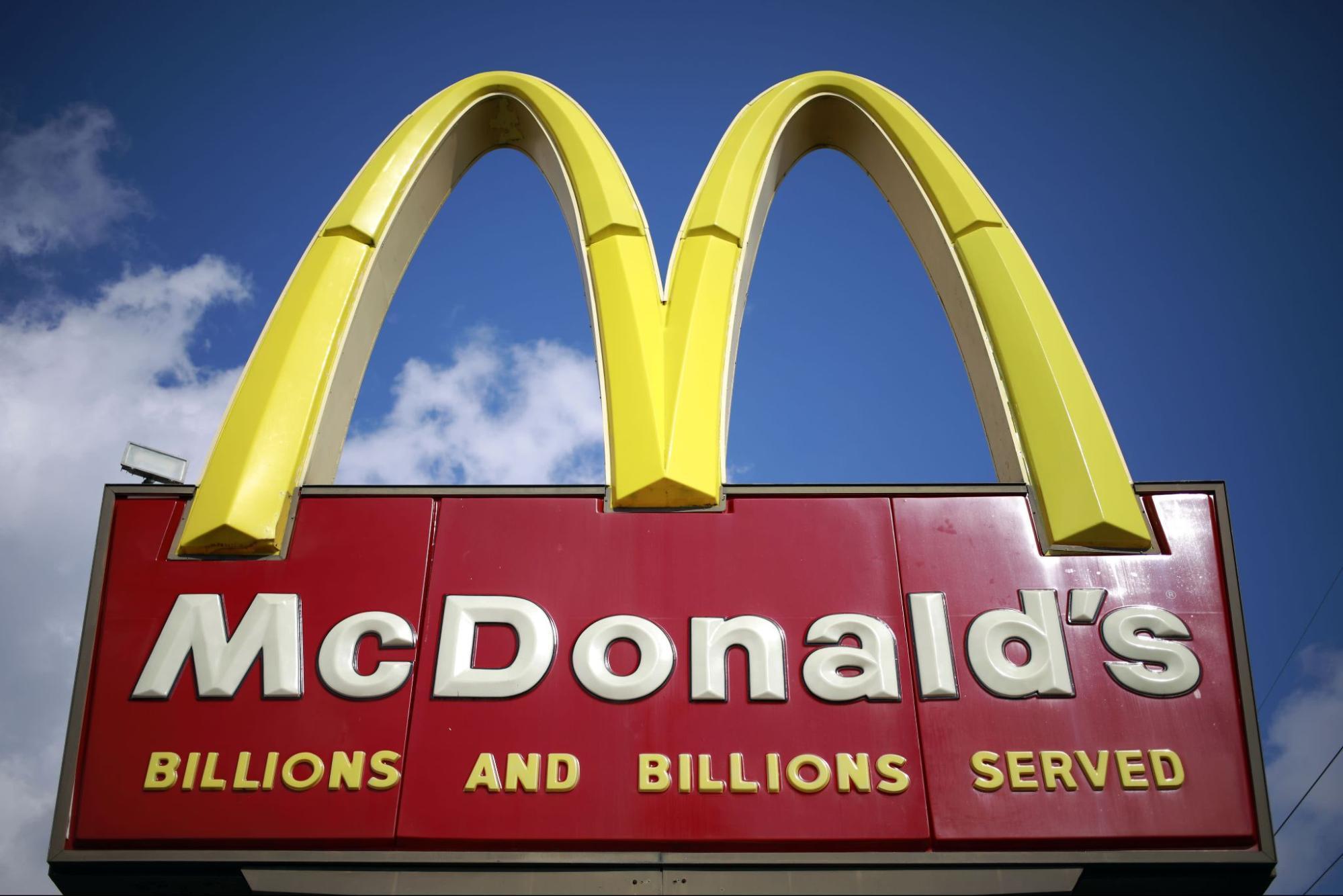 Red and yellow McDonald's sign - Billions and billions served