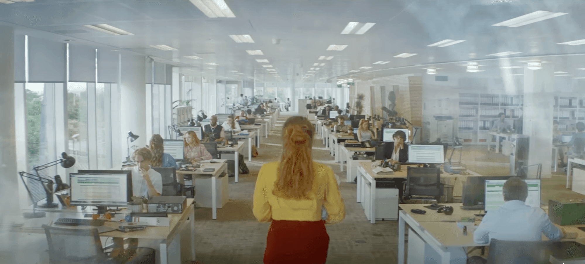 Woman in McDonald's colors walking through office in a McDonald's unbranded strategy video