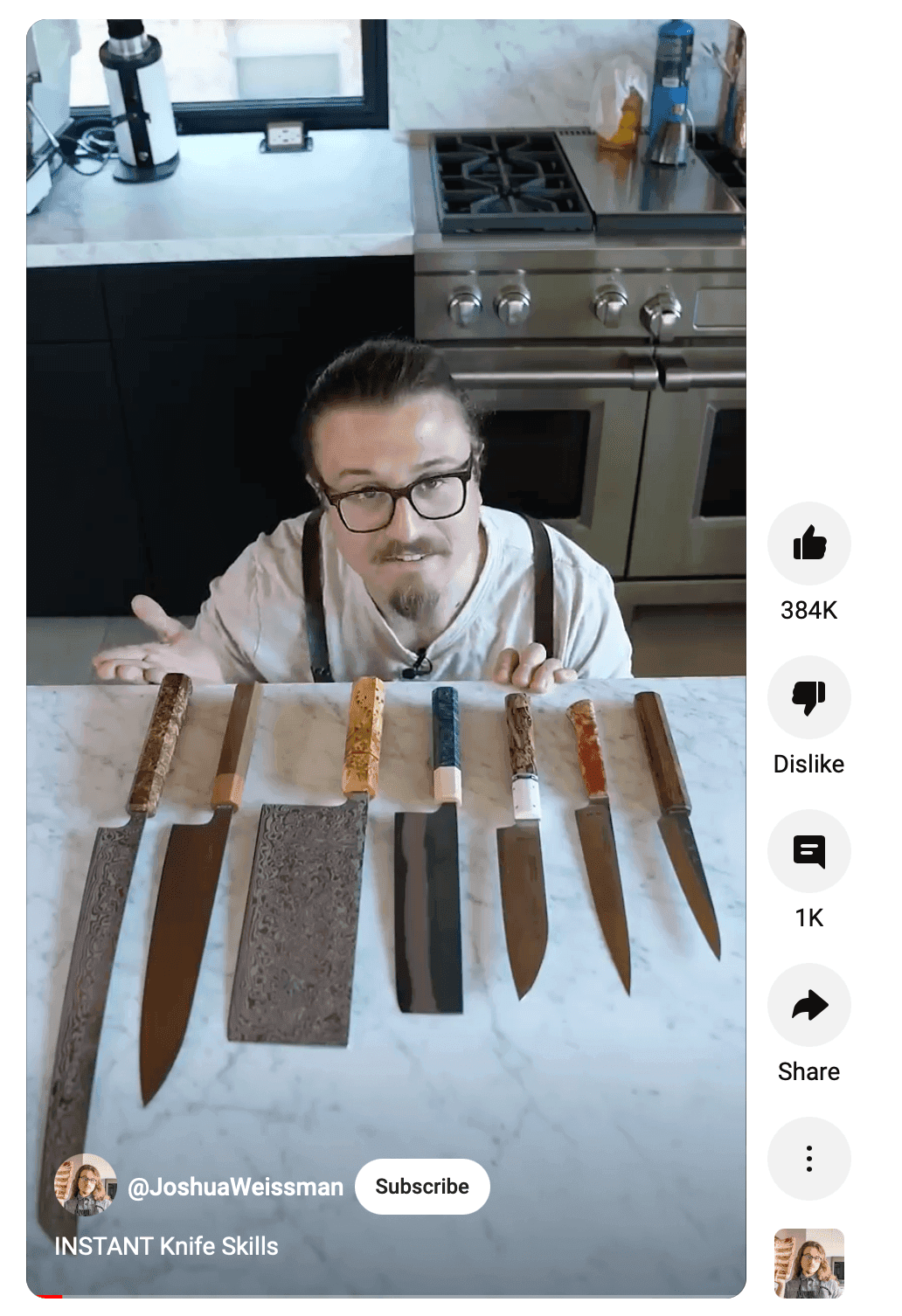 Man crouched behind counter with kitchen knifes laid out