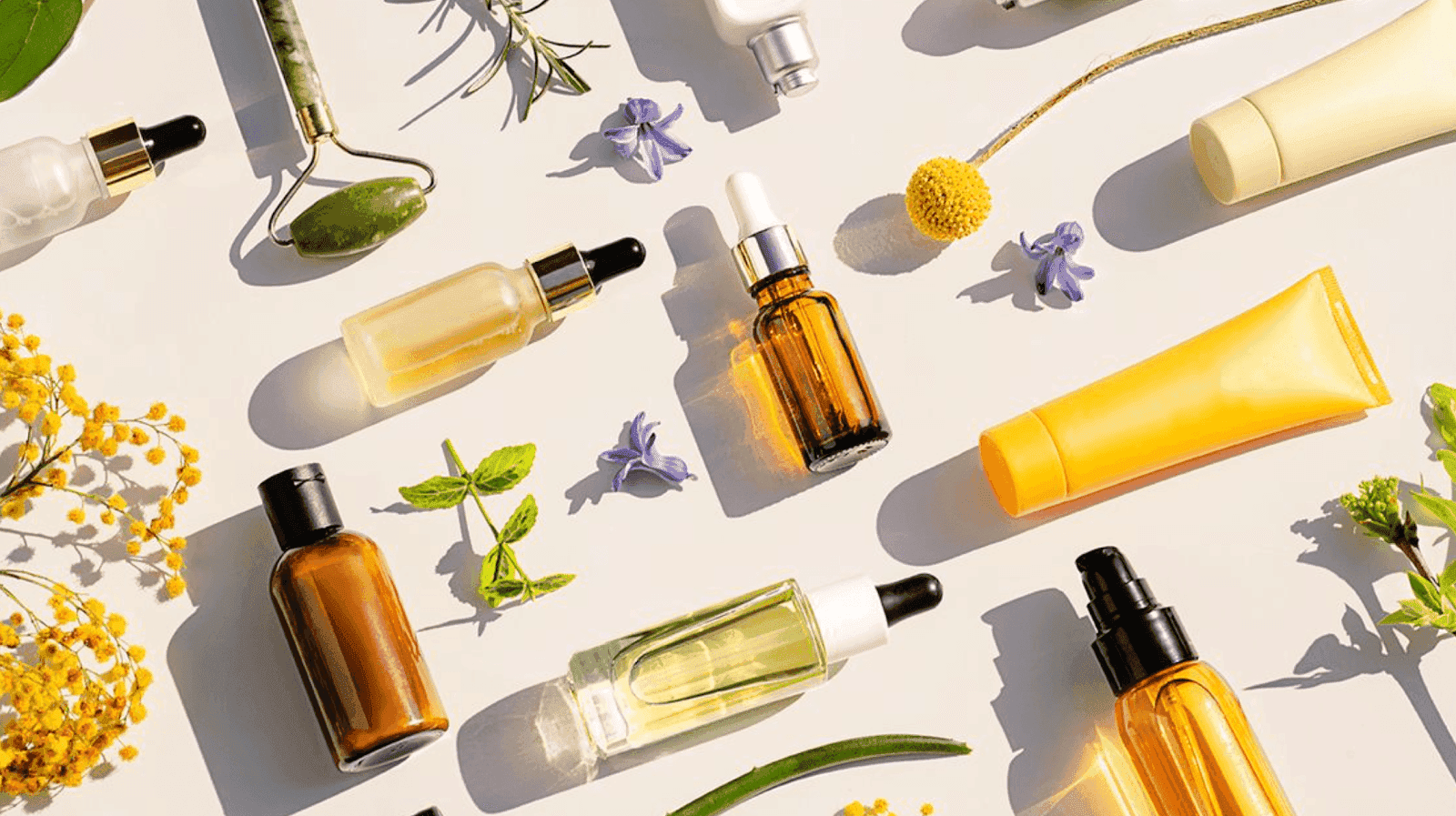 Beauty products with flowers around them